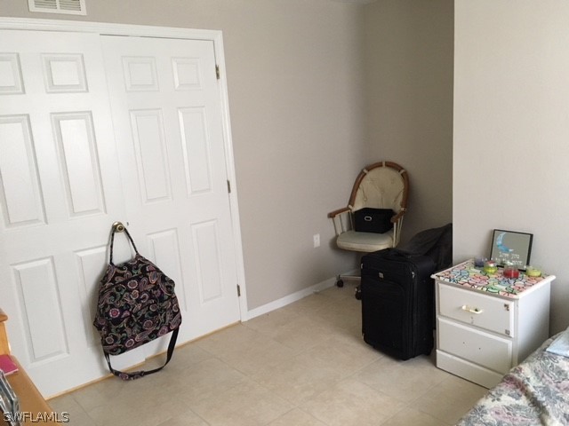 789 Alabama Road South Lehigh Acres, FL 33974 - Photo 11 of 30 a living room with furniture and a table