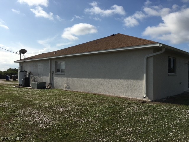 789 Alabama Road South Lehigh Acres, FL 33974 - Photo 15 of 30 a backyard of a house