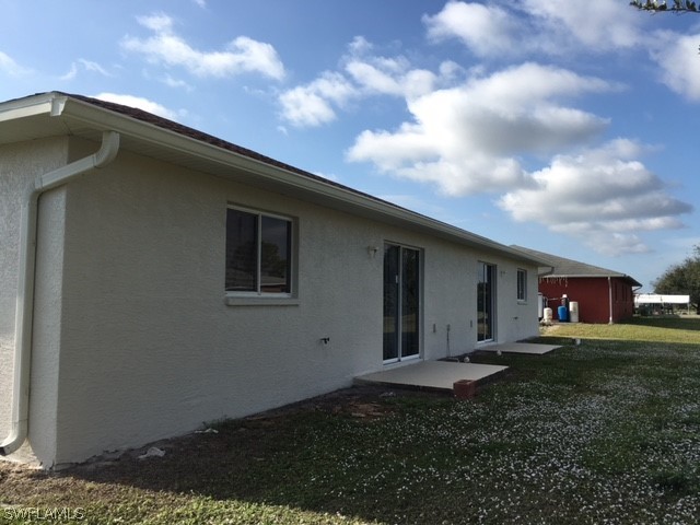 789 Alabama Road South Lehigh Acres, FL 33974 - Photo 16 of 30 a backyard of a house