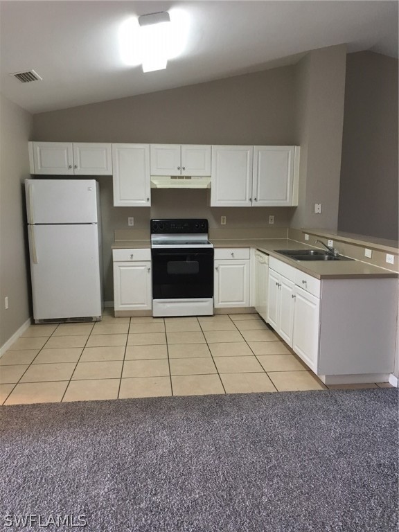 789 Alabama Road South Lehigh Acres, FL 33974 - Photo 17 of 30 a kitchen with a sink a stove and cabinets