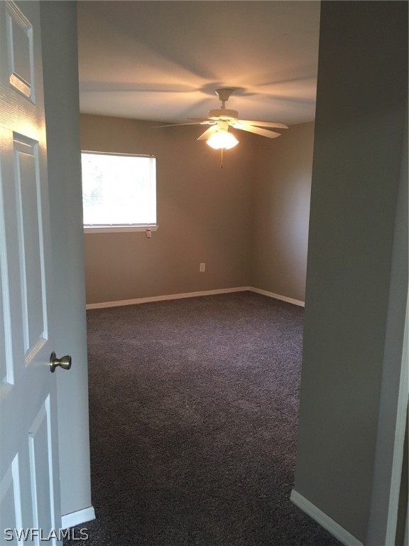 789 Alabama Road South Lehigh Acres, FL 33974 - Photo 24 of 30 a view of an empty room with a window