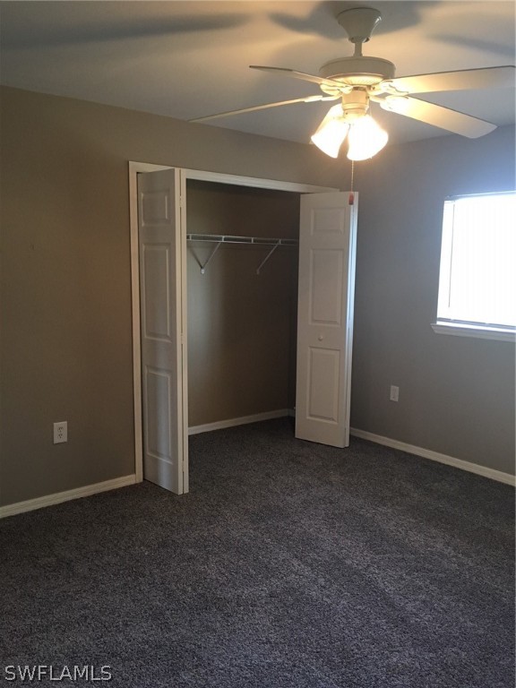 789 Alabama Road South Lehigh Acres, FL 33974 - Photo 25 of 30 a view of an empty room with a chandelier fan