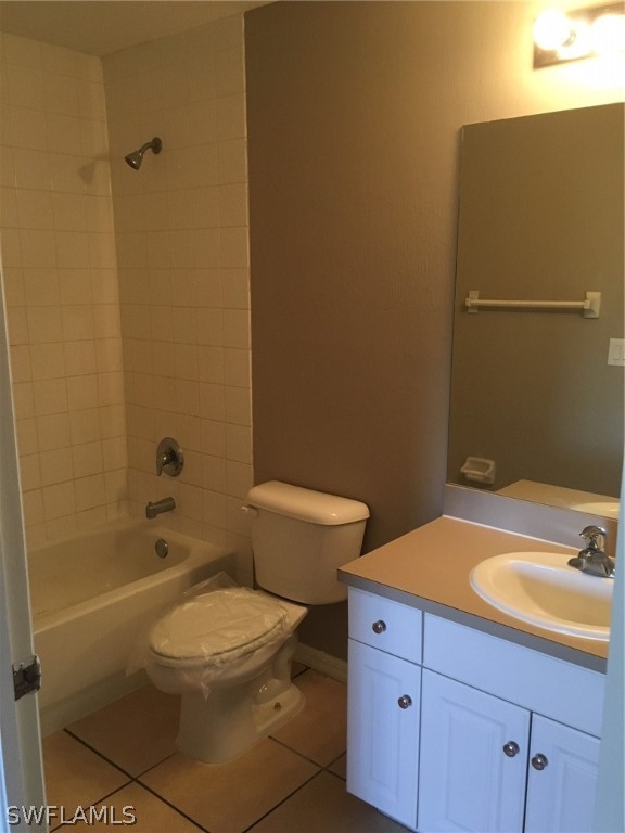 789 Alabama Road South Lehigh Acres, FL 33974 - Photo 26 of 30 a bathroom with a sink a toilet and shower