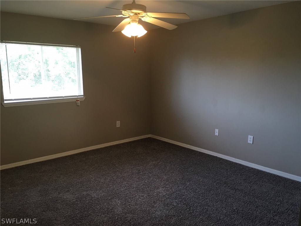 789 Alabama Road South Lehigh Acres, FL 33974 - Photo 27 of 30 a view of an empty room with a window