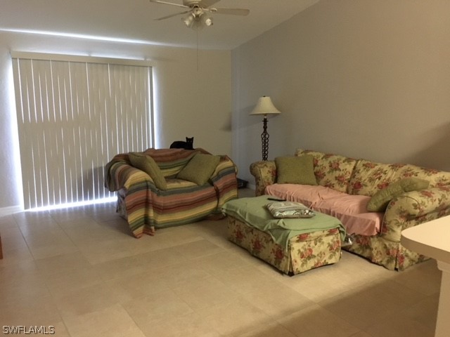 789 Alabama Road South Lehigh Acres, FL 33974 - Photo 4 of 30 a living room with furniture and a window
