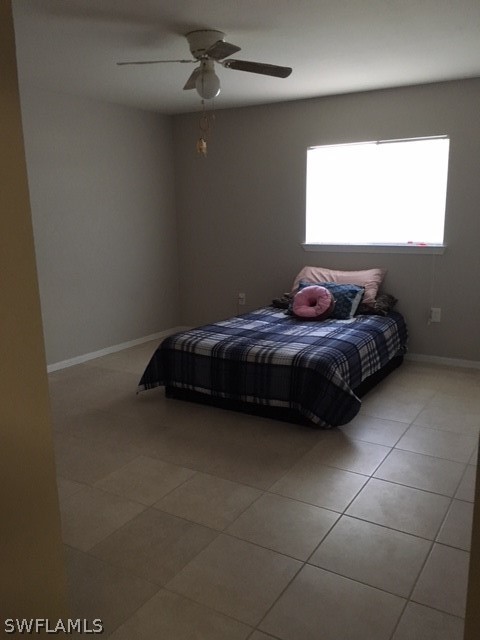 789 Alabama Road South Lehigh Acres, FL 33974 - Photo 6 of 30 a bedroom with a bed and a window