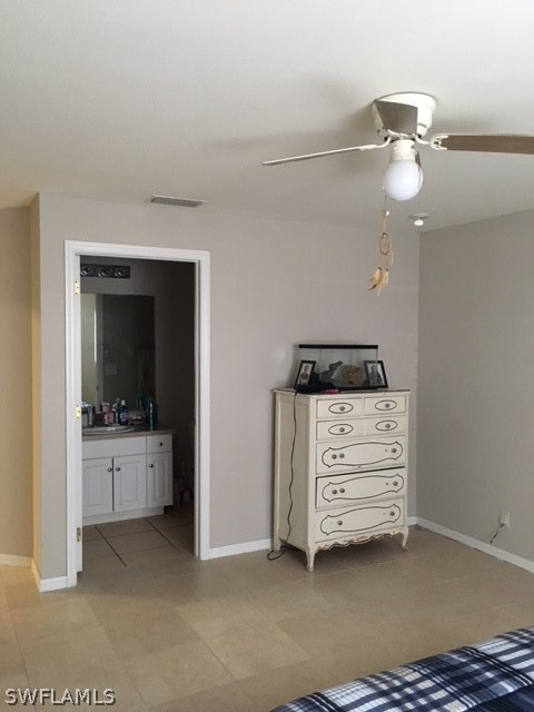 789 Alabama Road South Lehigh Acres, FL 33974 - Photo 7 of 30 a view of an empty room with cabinet and fire place