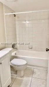 a bathroom with a sink a toilet and bathtub
