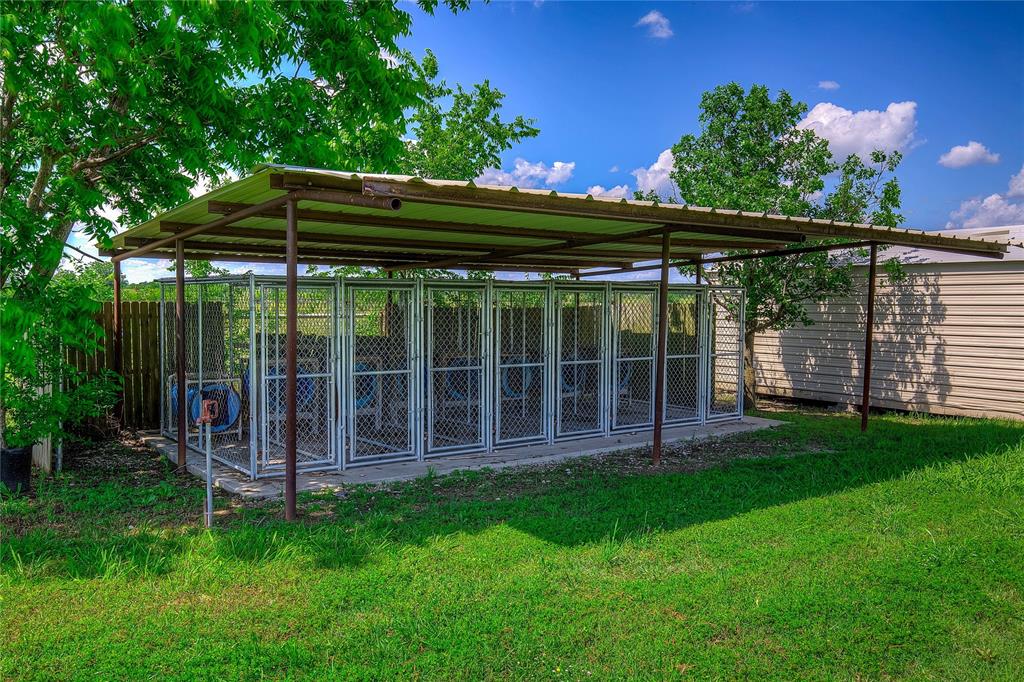 10000 County Road 357 Terrell, TX 75161 - Photo 16 of 38 a view of a backyard with wooden floor and fence