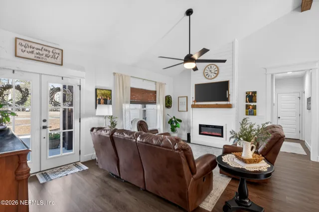 a kitchen with stainless steel appliances stove microwave and white cabinets