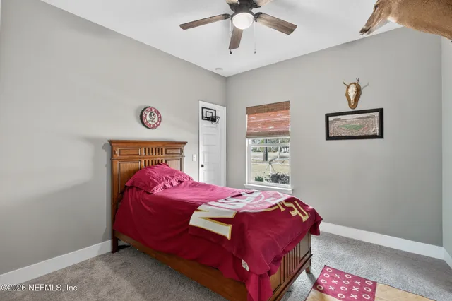 a bed room with a bed and a television