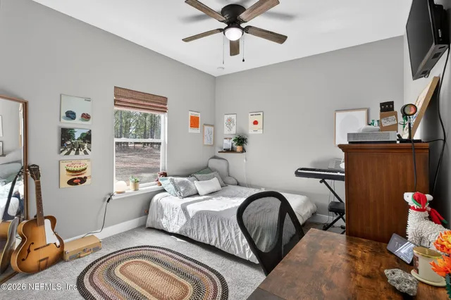 a bedroom with a bed and a cabinets