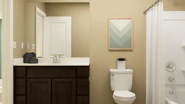 a bathroom with a toilet a sink a mirror a shower and vanity