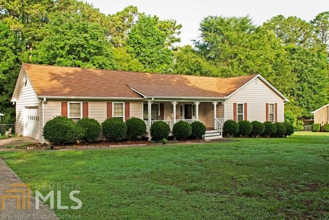 787 Flat Rock Road Stockbridge, GA 30281 - Photo 1 of 1 a front view of a house with a yard and green space