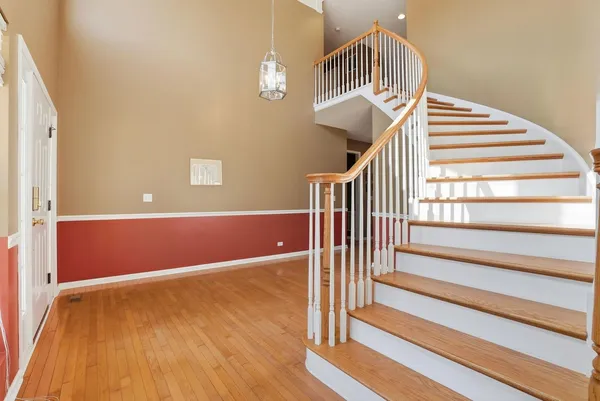 a view of entryway with wooden floor