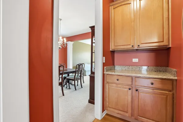 an entryway with dining table and chairs