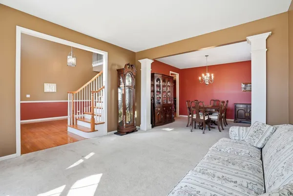 a view of a livingroom with furniture and a porch