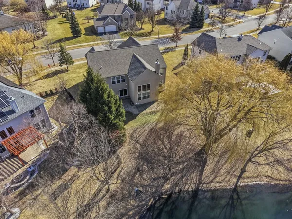 an aerial view of residential houses with outdoor space