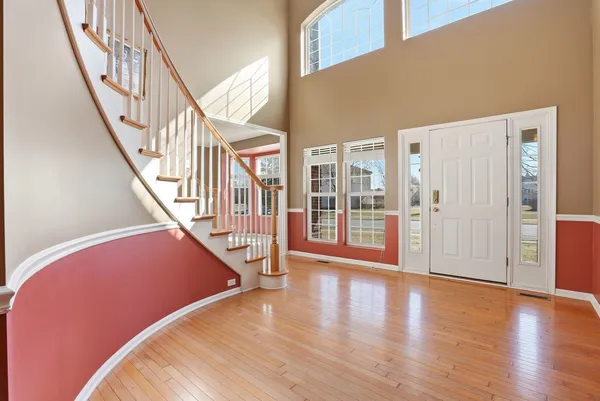 a view of an entryway with wooden floor
