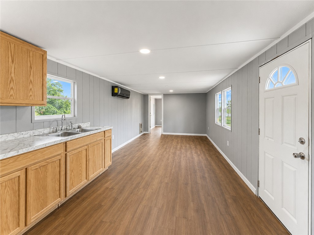3301 Dixon Road Anderson, SC 29625 - Photo 9 of 20 An inviting open-concept living space features wood flooring and a functional kitchen area.