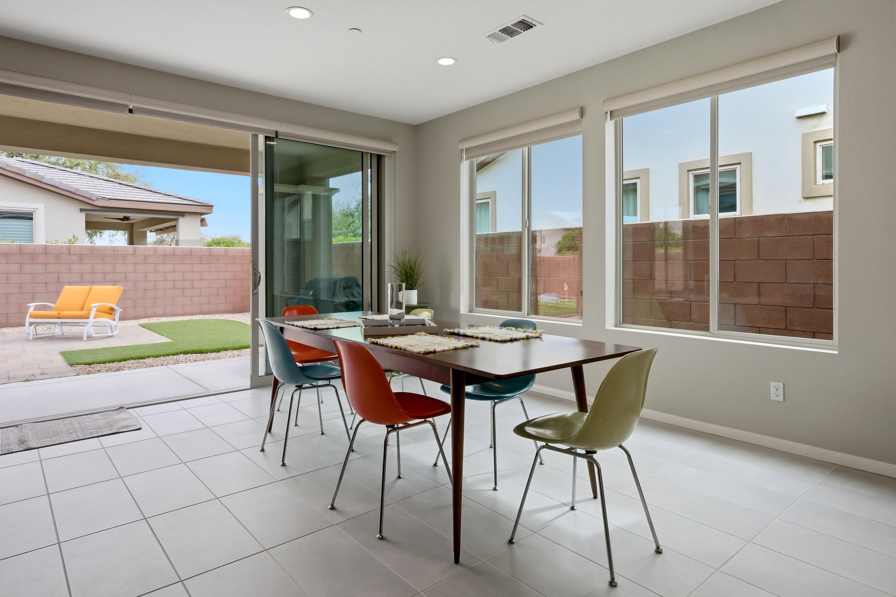 51370 North Two Palms Way Indio, CA 92201 - Photo 11 of 37 a view of a dining room with furniture and window