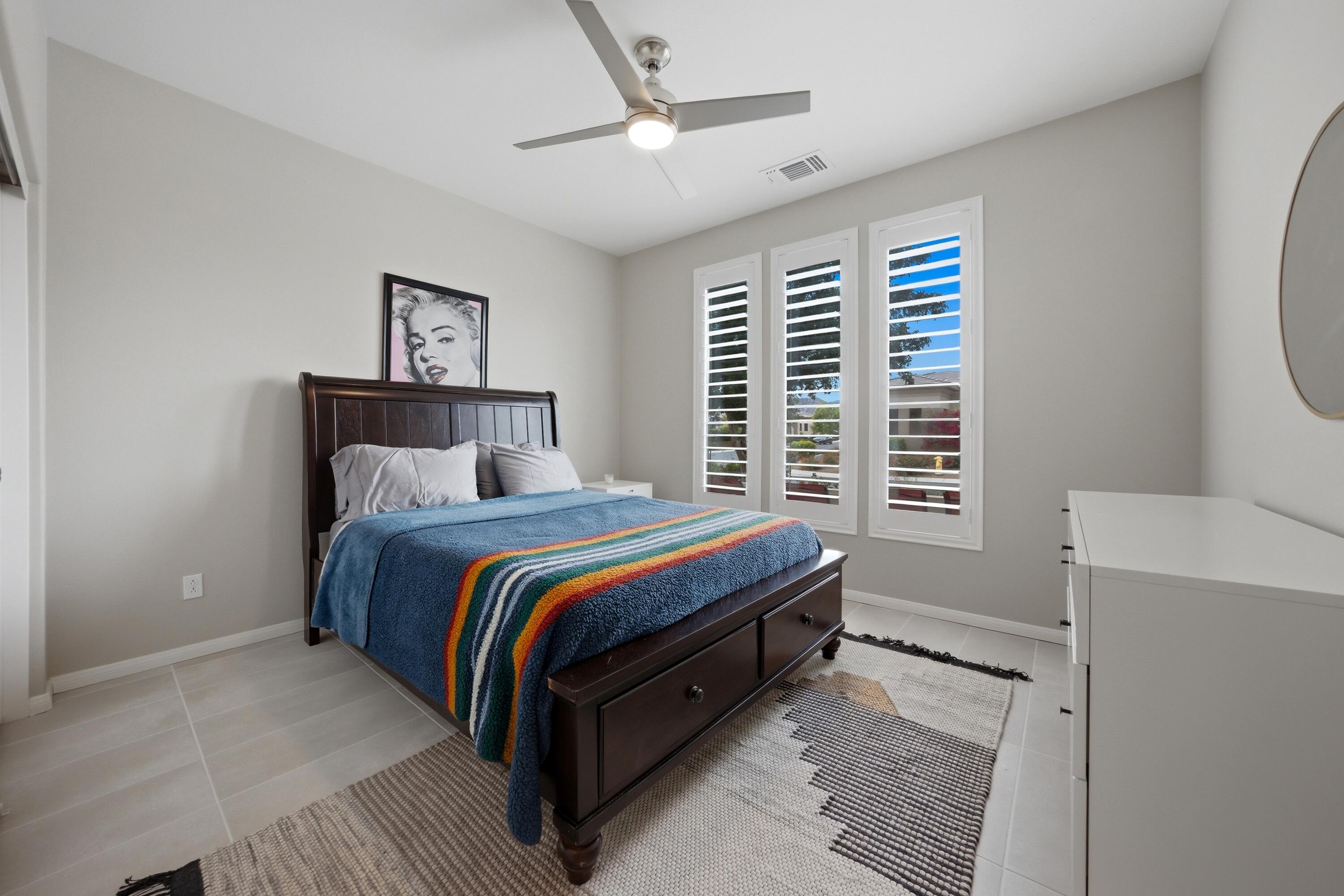 51370 North Two Palms Way Indio, CA 92201 - Photo 21 of 37 a bed room with a bed and a window