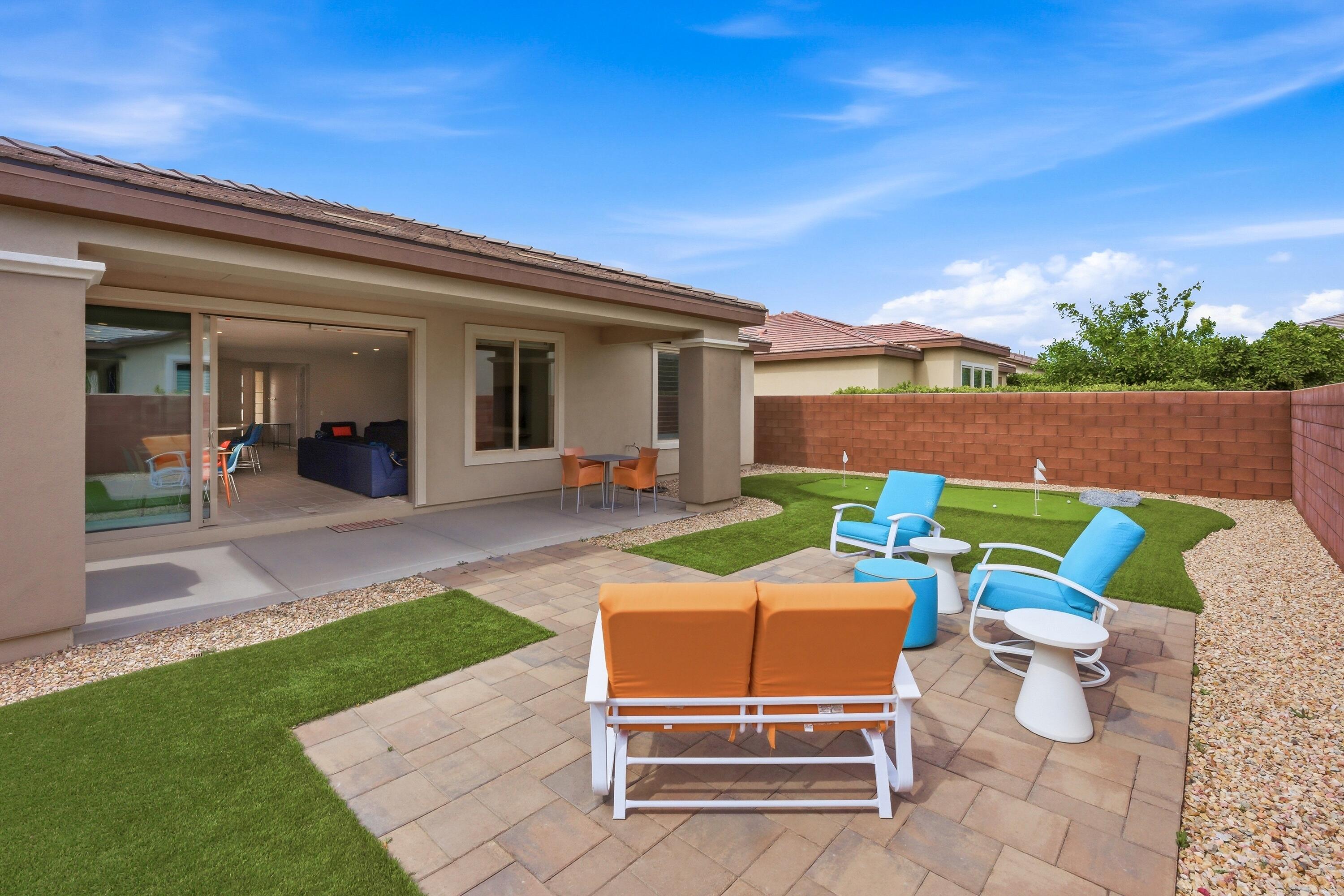 51370 North Two Palms Way Indio, CA 92201 - Photo 25 of 37 a backyard of a house with table and chairs
