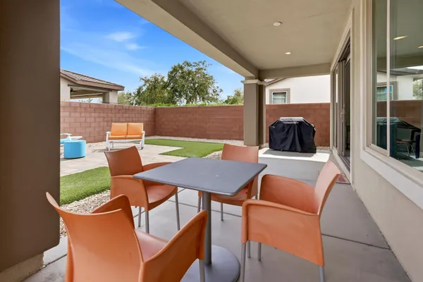 a view of a dining room with furniture window and outside view