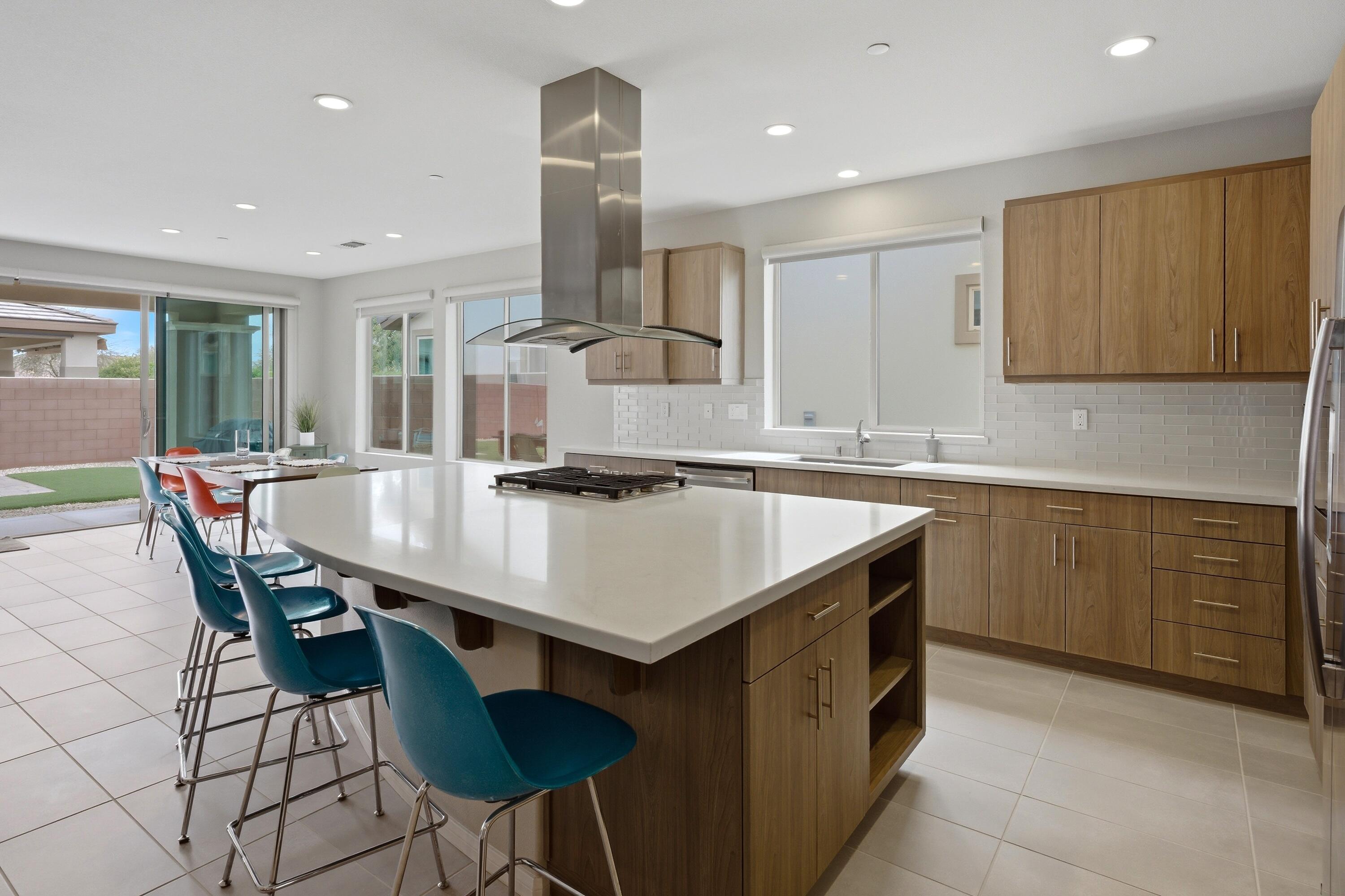 51370 North Two Palms Way Indio, CA 92201 - Photo 8 of 37 a kitchen with a table chairs sink and cabinets