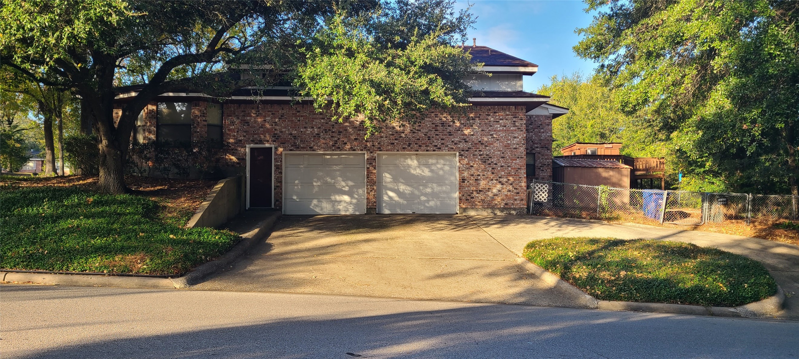 2604 Bois D Arc Drive Huntsville, TX 77320 - Photo 1 of 12 a front view of a house with garden