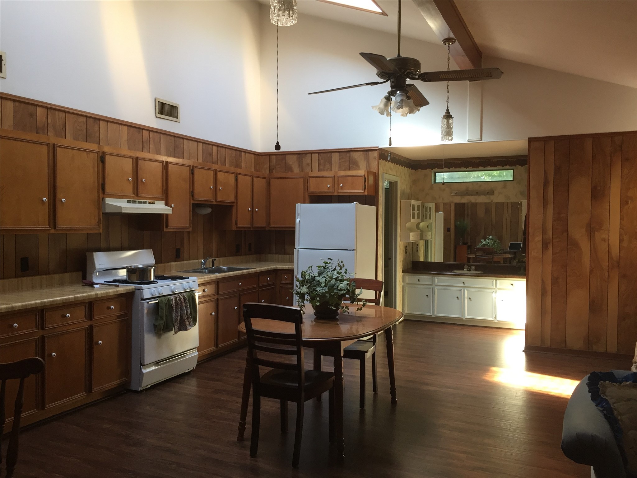 2604 Bois D Arc Drive Huntsville, TX 77320 - Photo 6 of 12 a kitchen with a table chairs stove and cabinets