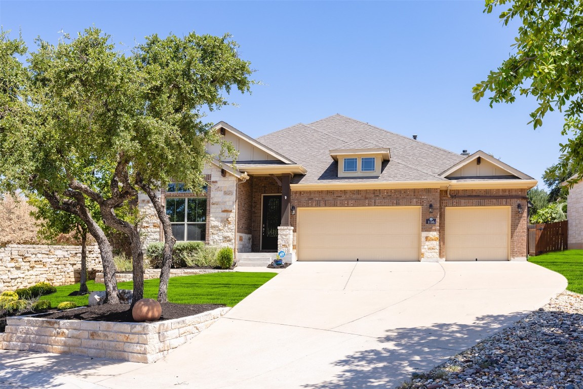 116 Clear Ridge Cove Georgetown, TX 78628 - Photo 1 of 1 a front view of a house with a yard and garage