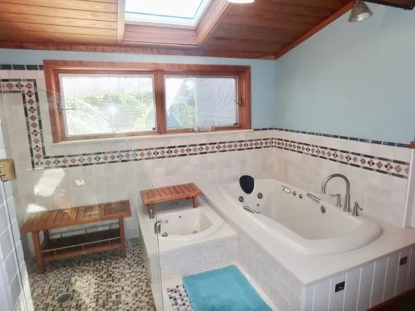 a bathroom with a sink and a window