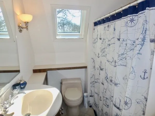 a bathroom with a toilet and a sink