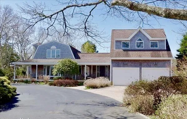 a view of a house with a street