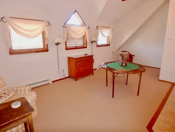 a bedroom with a bed and a table in it