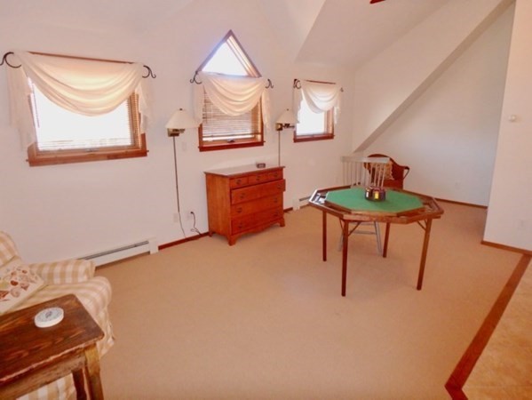 17 Otis Bassett Road West Tisbury, MA 02568 - Photo 23 of 28 a bedroom with a bed and a table in it