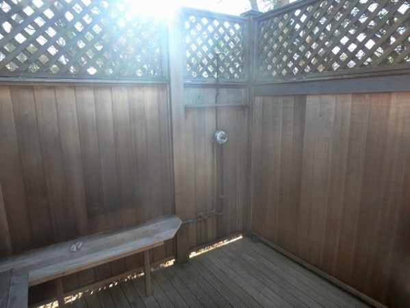 17 Otis Bassett Road West Tisbury, MA 02568 - Photo 26 of 28 a wooden bench sitting in a bathroom near a shower