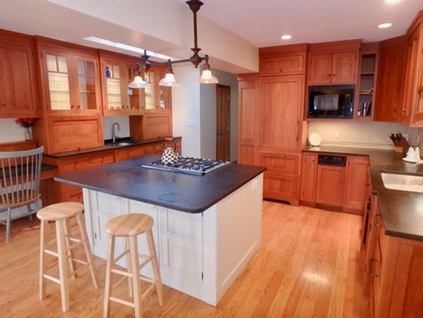 17 Otis Bassett Road West Tisbury, MA 02568 - Photo 3 of 28 a kitchen with stainless steel appliances granite countertop a sink stove and refrigerator