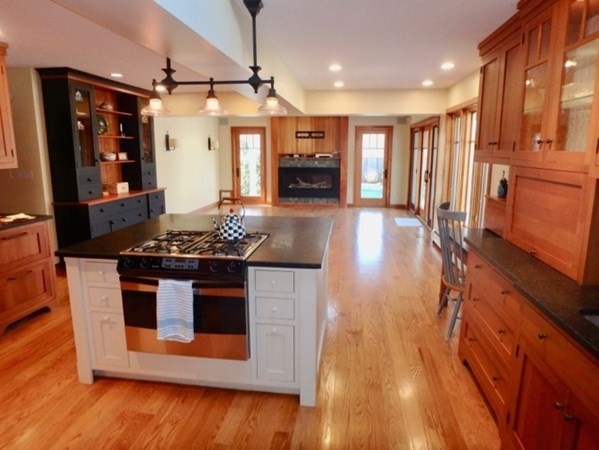17 Otis Bassett Road West Tisbury, MA 02568 - Photo 4 of 28 a kitchen with stainless steel appliances granite countertop a stove and a refrigerator