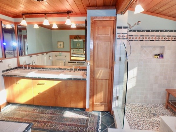 17 Otis Bassett Road West Tisbury, MA 02568 - Photo 6 of 28 a bathroom with a sink and a mirror