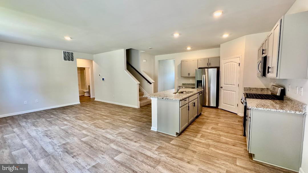 1236 Pimpernell Path Middletown, DE 19709 - Photo 1 of 37 a kitchen with stainless steel appliances a refrigerator and a stove top oven
