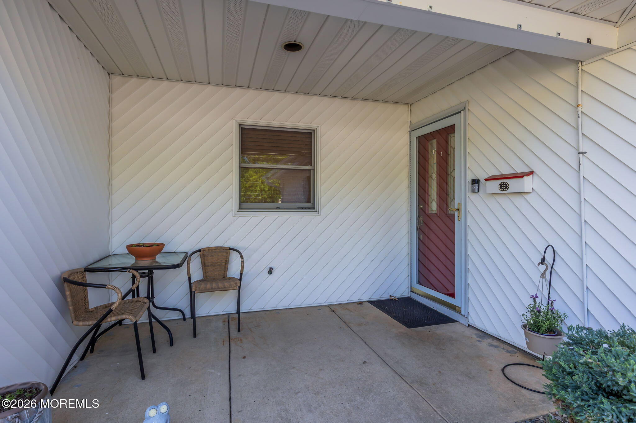 101 Andover Lane Matawan, NJ 07747 - Photo 5 of 51 a view of a patio with table and chairs and potted plants