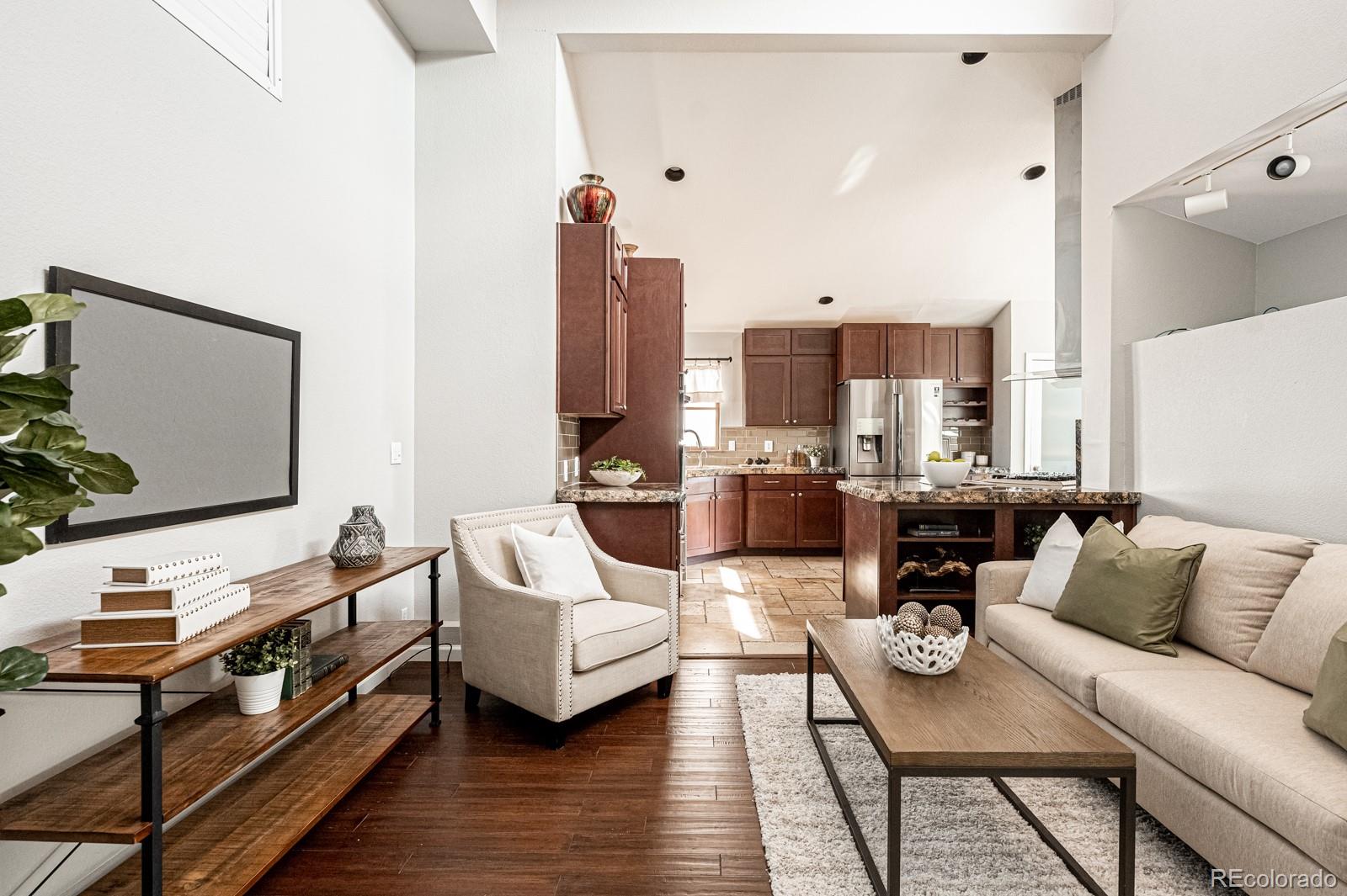 620 Cascade Drive Golden, CO 80403 - Photo 12 of 31 a living room with furniture and a flat screen tv