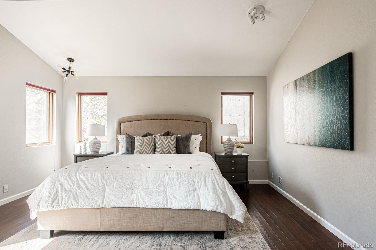 620 Cascade Drive Golden, CO 80403 - Photo 19 of 31 a large bed sitting in a bedroom next to a window