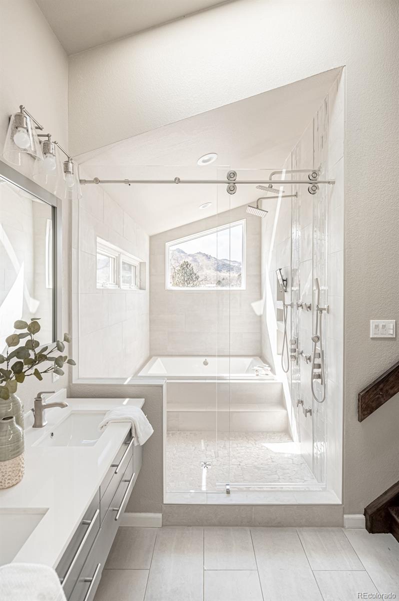 620 Cascade Drive Golden, CO 80403 - Photo 23 of 31 a spacious bathroom with a tub sink and mirror