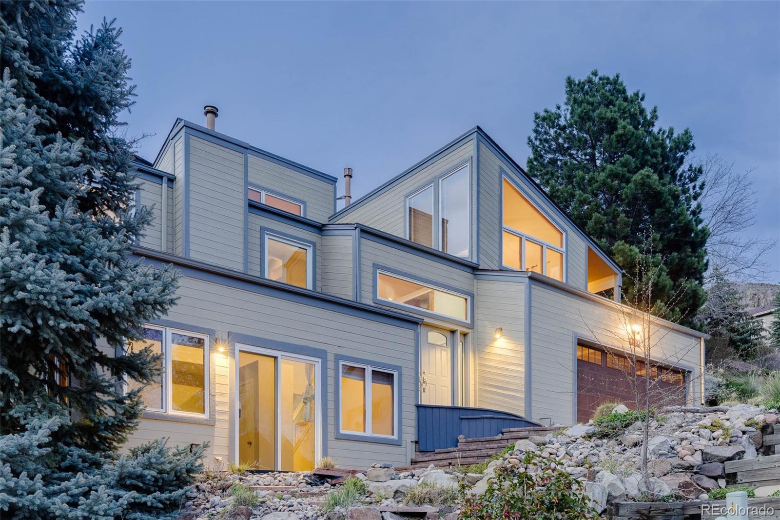 620 Cascade Drive Golden, CO 80403 - Photo 4 of 31 a front view of a house with garden