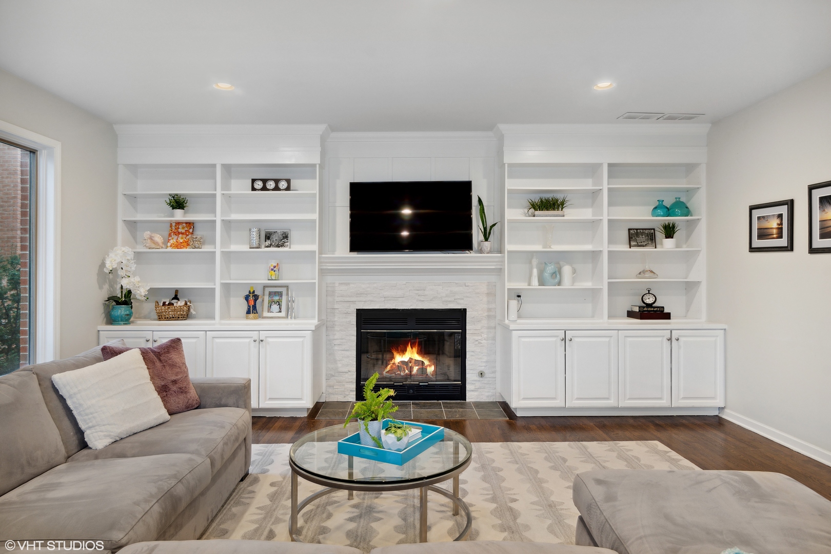 1041 Pontiac Road Wilmette, IL 60091 - Photo 11 of 33 a living room with furniture a flat screen tv and a fireplace