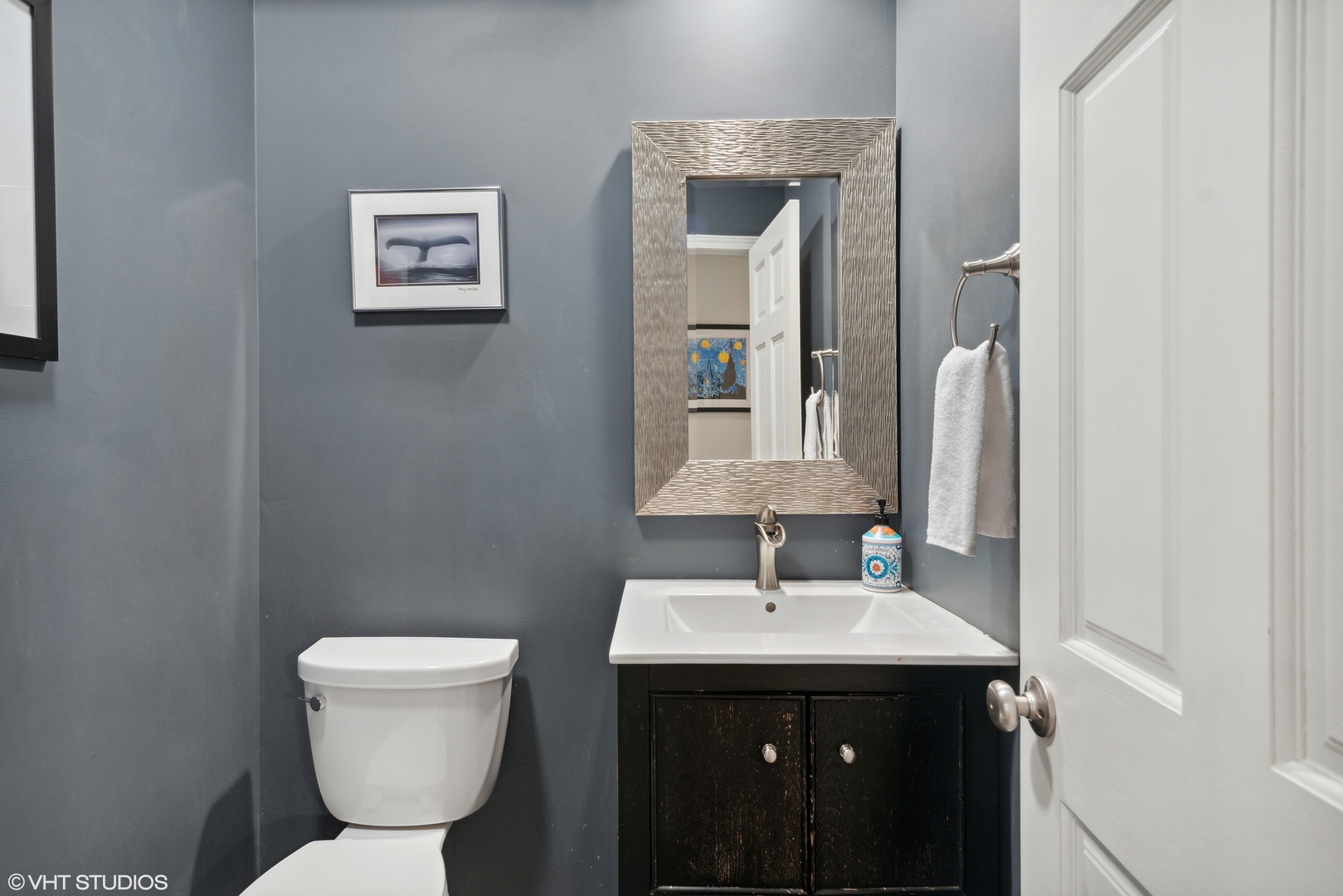 1041 Pontiac Road Wilmette, IL 60091 - Photo 14 of 33 a bathroom with a toilet sink and mirror