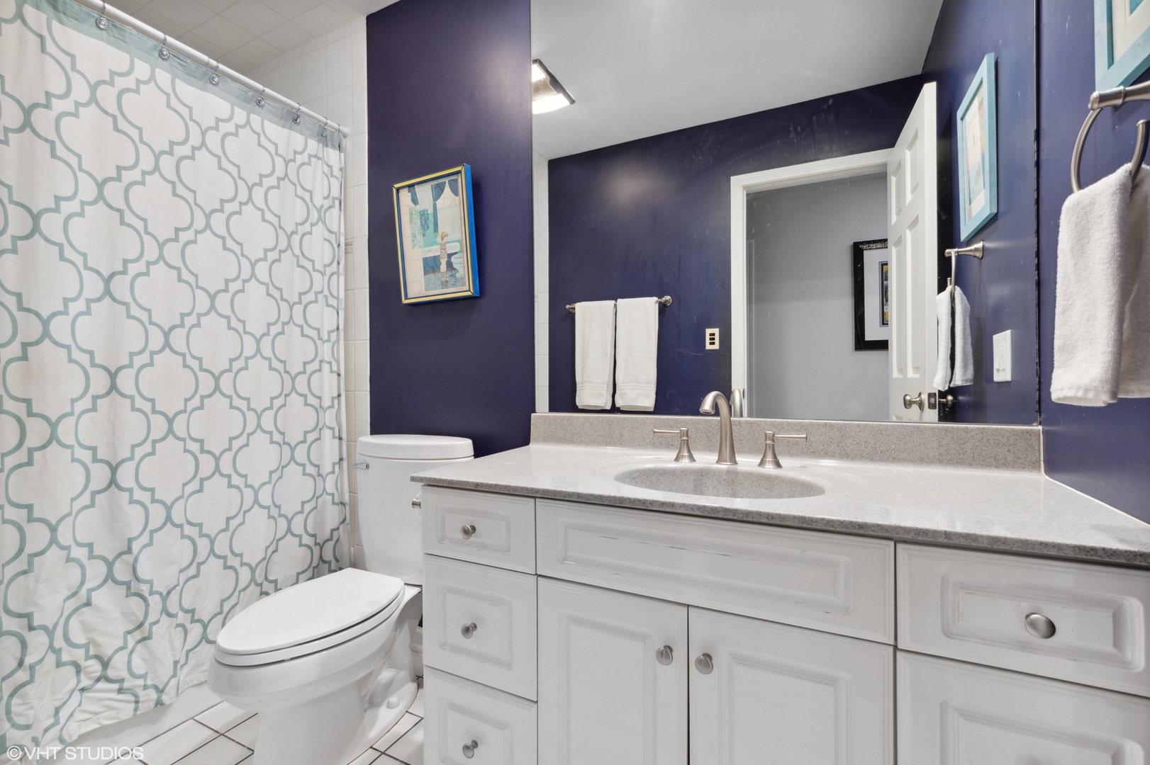 1041 Pontiac Road Wilmette, IL 60091 - Photo 21 of 33 a bathroom with a granite countertop toilet sink and mirror